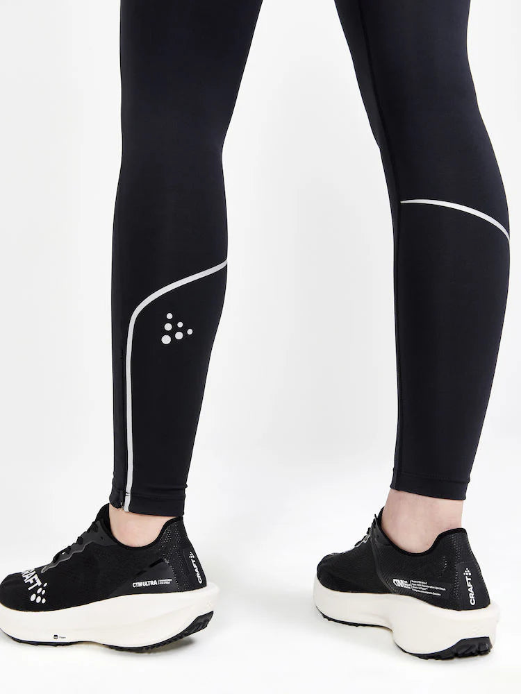 ADV Essence Run Tights - Women by Craft in black with reflective details, soft recycled polyester, wide waistband, ideal for running and training