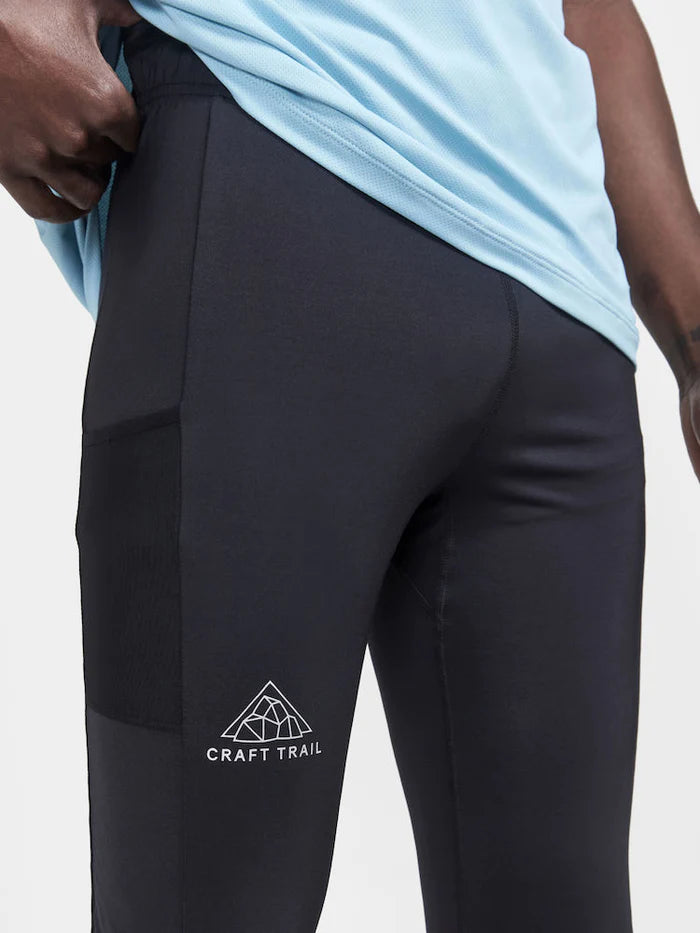 PRO Trail Tights - Men by Craft in black, recycled polyamide jersey running tights with moisture transfer, ideal for trail running.