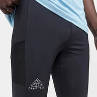 PRO Trail Tights - Men by Craft in black, recycled polyamide jersey running tights with moisture transfer, ideal for trail running.
