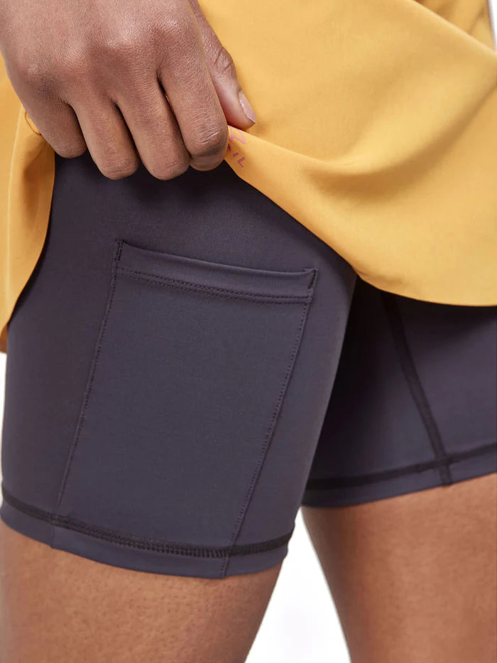 PRO Trail 2in1 Skirt - Women by Craft in yellow and black with 4-way stretch recycled polyester, ideal for high-performance trail running
