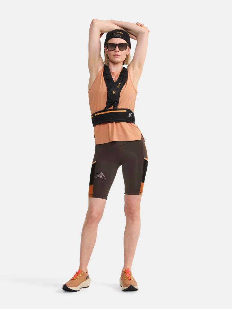 PRO Trail Singlet - Women by Craft in peach, jacquard-knit ripstop fabric designed for high-intensity trail running comfort.