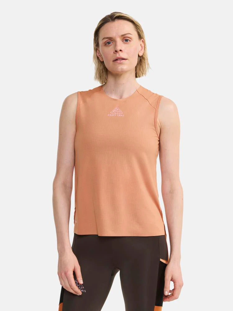 PRO Trail Singlet - Women by Craft in light orange with jacquard-knit ripstop fabric, designed for high-intensity trail running and performance