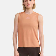 PRO Trail Singlet - Women by Craft in light orange with jacquard-knit ripstop fabric, designed for high-intensity trail running and performance