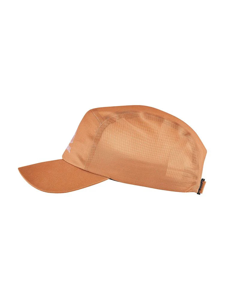 PRO Run Soft Cap by Craft in burnt orange with mesh side panels, taped seams, and inner mesh for ventilation in high-intensity running.
