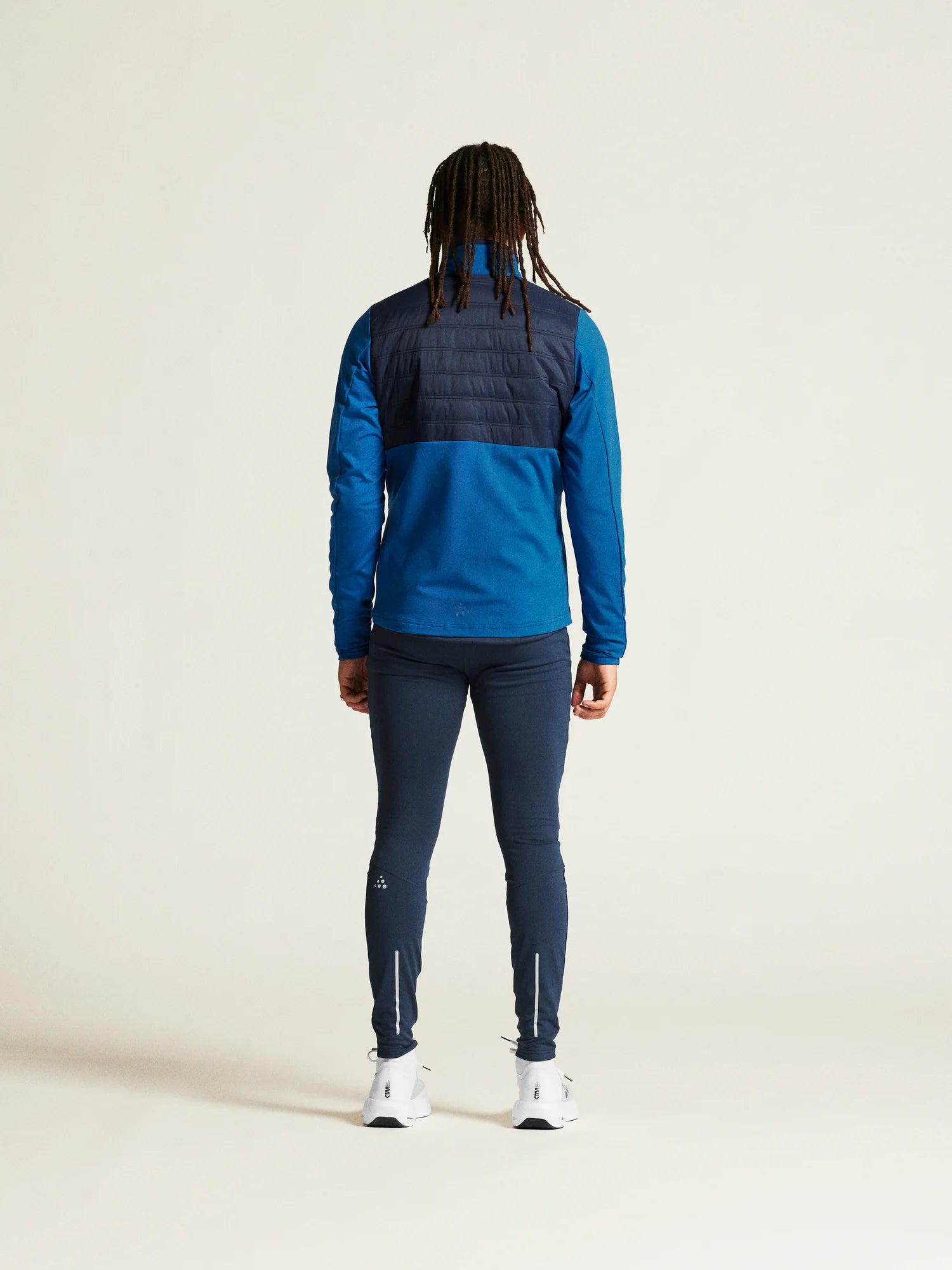 ADV Essence Warm Jacket 2 - Men by Craft in blue and navy with quilted padding and wind protection for cold weather training