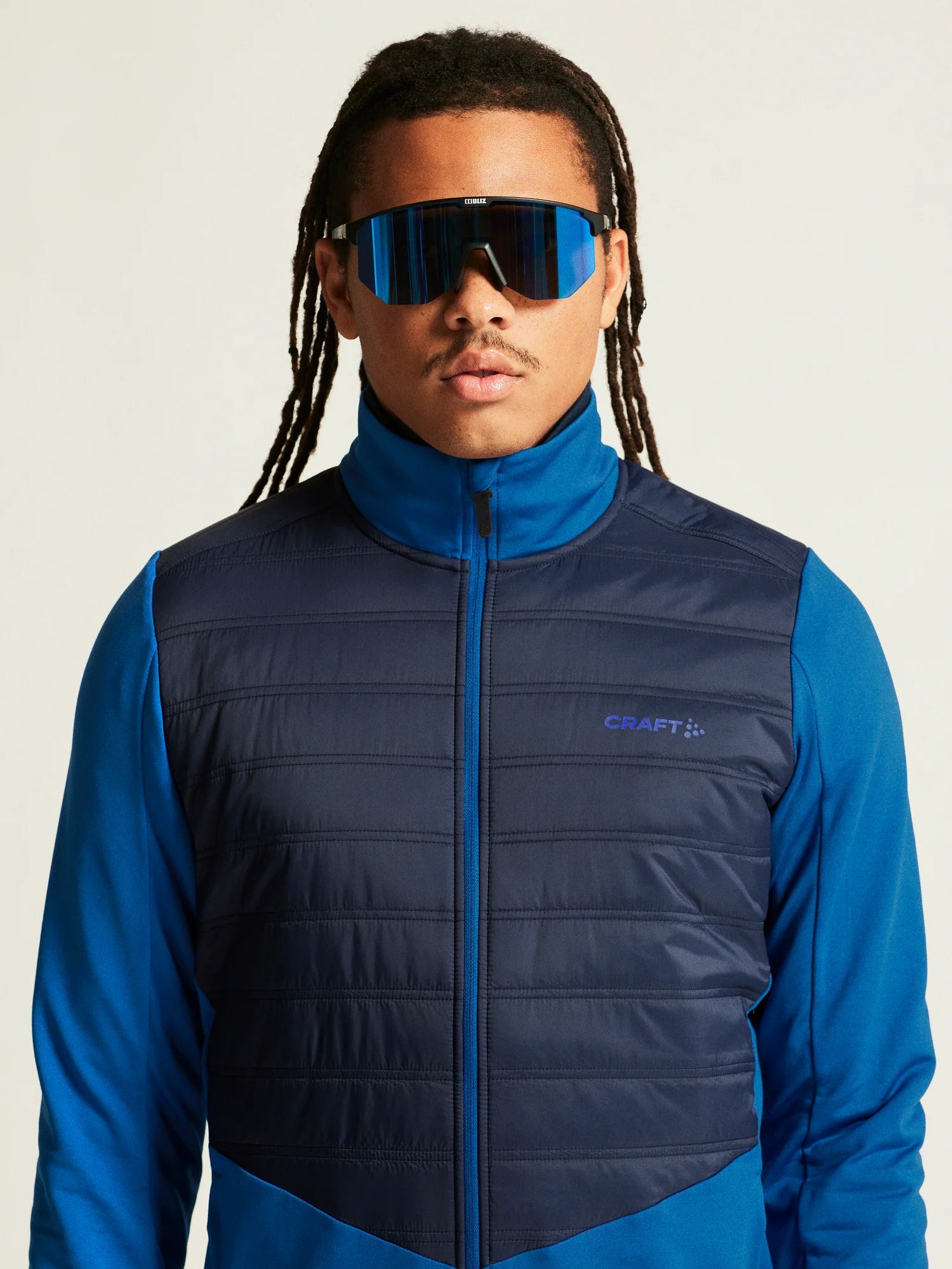 ADV Essence Warm Jacket 2 - Men by Craft in blue and navy, warm quilted multi-sport jacket with wind protection for cold weather training