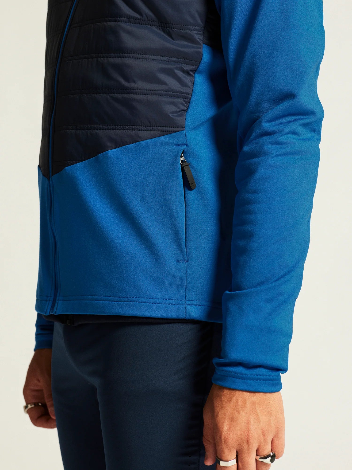 ADV Essence Warm Jacket 2 - Men by Craft in blue and black, warm, wind-protective jacket with quilted padding for cold weather workouts