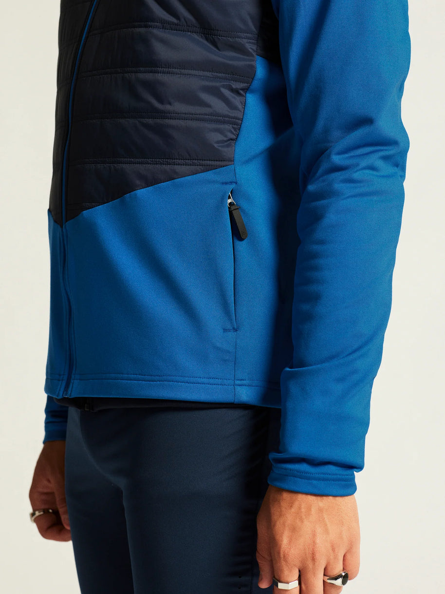 ADV Essence Warm Jacket 2 - Men by Craft in blue and black, warm, wind-protective jacket with quilted padding for cold weather workouts