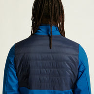 ADV Essence Warm Jacket 2 - Men by Craft in blue with black quilted padding, warm wind-protective jacket for cold weather workouts.
