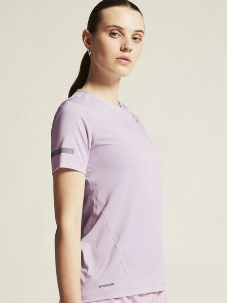 Woman wearing the Craft Pro Hypervent Tee 2 women's T-shirt in Aster, three-quarter close-up
