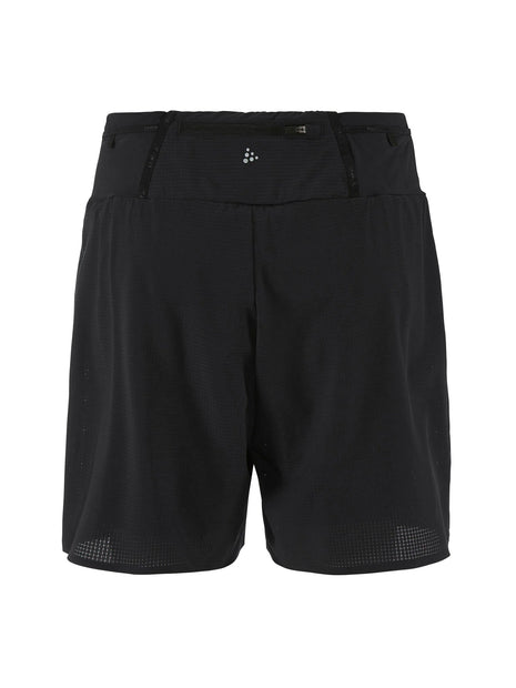 Craft Pro Trail Shorts men's running shorts in Black/Black, back view laid flat with zip pocket and logo
