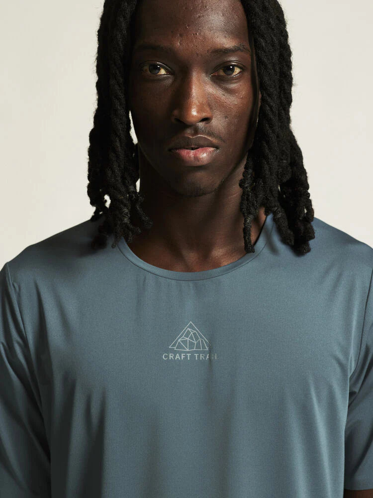 PRO Trail SS Tee 2 - Men in muted blue by Craft, lightweight jacquard fabric designed for high-intensity trail running performance