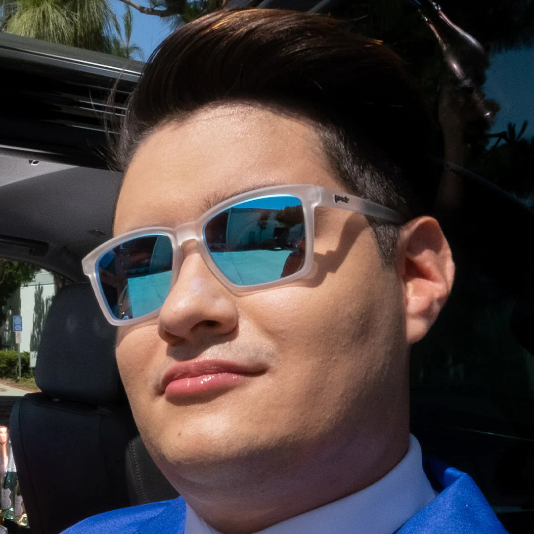 Middle Seat Advantage by Goodr in translucent frame with vibrant blue mirrored lenses, slim fit for smaller faces, glare reduction designed for running.