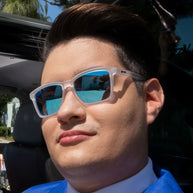 Middle Seat Advantage by Goodr in translucent frame with vibrant blue mirrored lenses, slim fit for smaller faces, glare reduction designed for running.