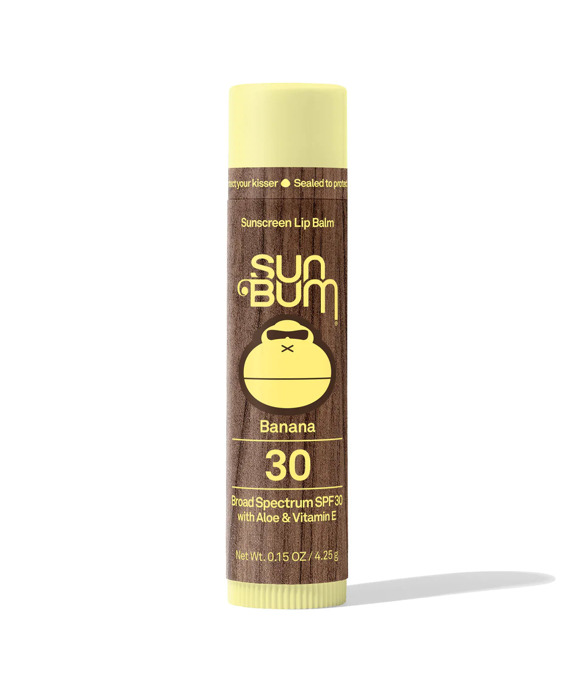 Lipbalm SPF 30 by Sun Bum in brown and yellow, banana flavored with Aloe and Vitamin E, moisturizing lip protection with broad spectrum SPF30