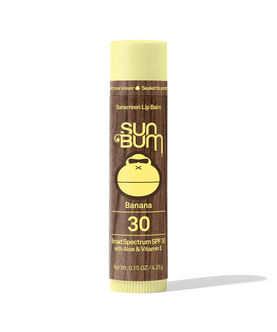 Lipbalm SPF 30 by Sun Bum in brown and yellow, banana flavored with Aloe and Vitamin E, moisturizing lip protection with broad spectrum SPF30