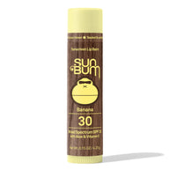 Lipbalm SPF 30 by Sun Bum in brown and yellow, banana flavored with Aloe and Vitamin E, moisturizing lip protection with broad spectrum SPF30
