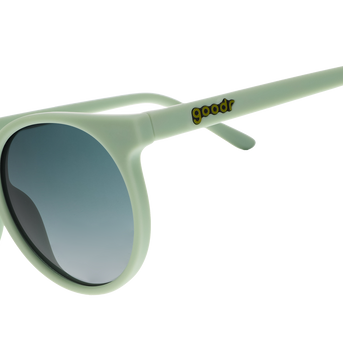 Goodr Incognito Plant Parent sunglasses, side view of round sage green frames with dark gradient lenses