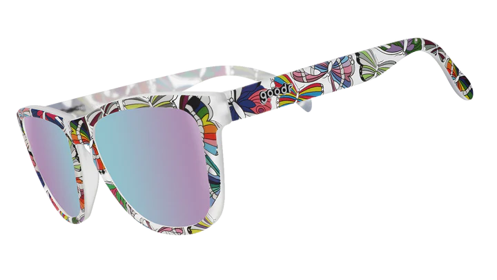 Is It Queer In Here Or Is It Just Us?! by Goodr in clear frames with vibrant LGBTQ+ butterfly patterns and purple lenses designed for Pride and outdoor use