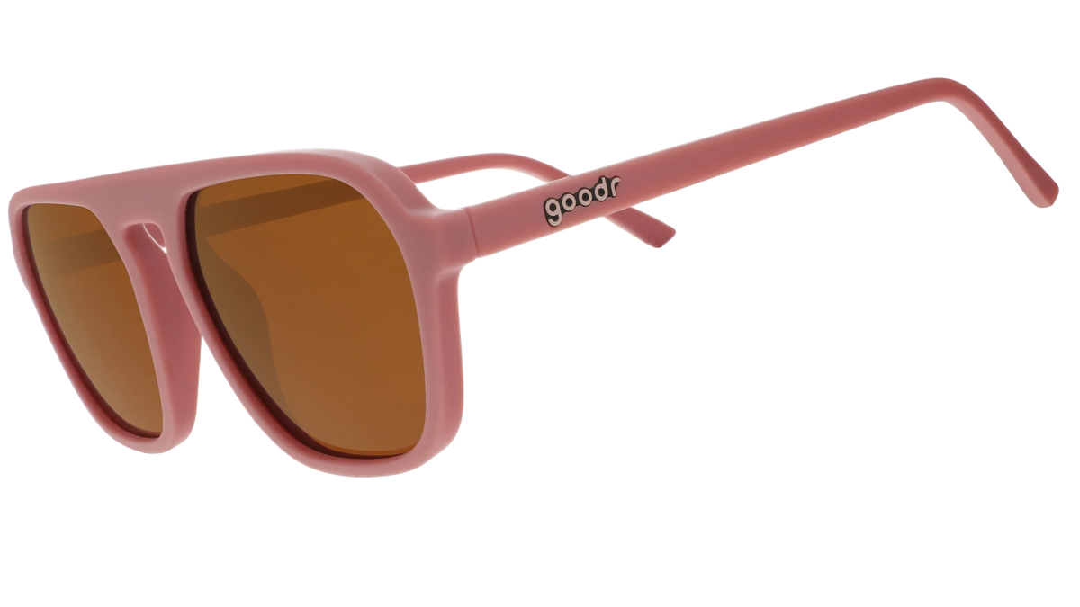 Threaten Me With a Good Time by Goodr in light pink vintage square aviator frames with brown non-reflective lenses for roller skating use