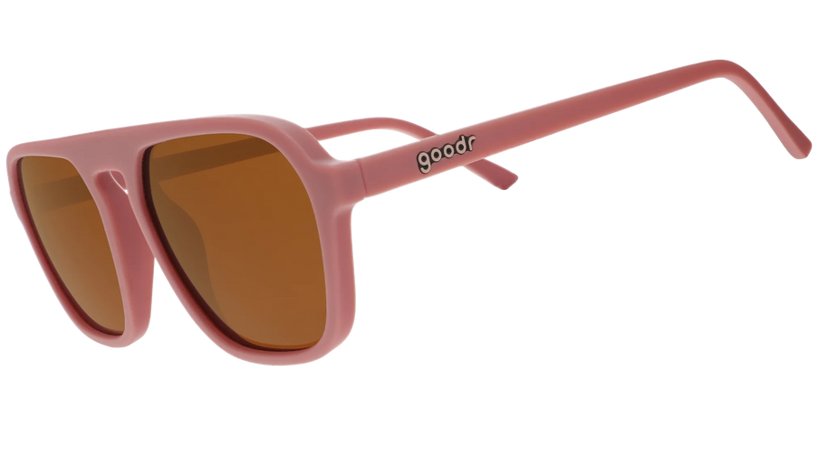 Threaten Me With a Good Time by Goodr in light pink vintage square aviator frames with brown non-reflective lenses for roller skating use