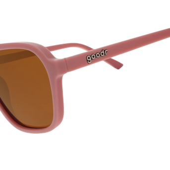 Threaten Me With a Good Time by Goodr in light pink vintage square aviator frames with brown non-reflective lenses for roller skating use