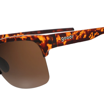 Country Club Crasher by Goodr brown tortoiseshell half-rim sunglasses with dual-lens wrap frame and adjustable nose piece for stylish disruption
