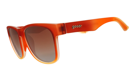 Wake & Bacon by Goodr in crispy brown with brown gradient polarized lenses, bacon-themed sunglasses with unique packaging for casual wear