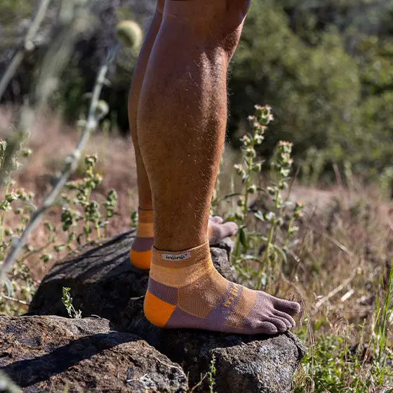 Trail Midweight Mini-Crew - Unisex by Injinji in orange and purple cushioned toesocks engineered for trail running and hiking comfort and support