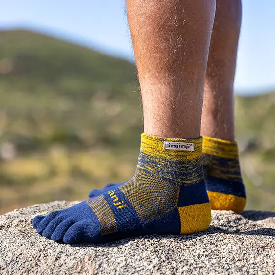 Trail Midweight Mini-Crew - Unisex by Injinji in blue and yellow, cushioned toesock for comfort and agility on uneven trails