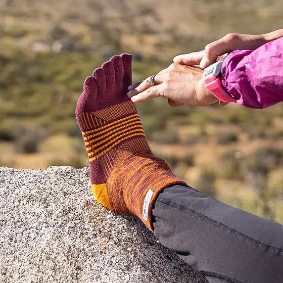 Trail Midweight Mini-Crew - Unisex by Injinji in maroon and orange cushioned toesock for trail running and hiking on uneven terrain