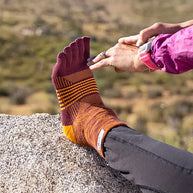 Trail Midweight Mini-Crew - Unisex by Injinji in maroon and orange cushioned toesock for trail running and hiking on uneven terrain