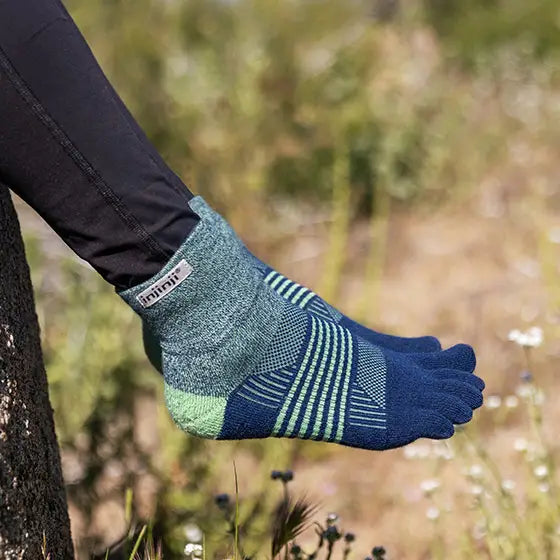 Trail Midweight Mini-Crew - Women by Injinji in blue and green cushioned toesocks for running and hiking on uneven trails with agile support