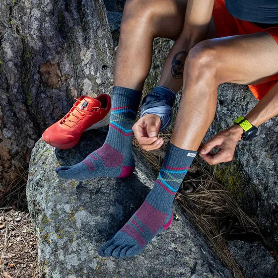 Trail Midweight Crew - Unisex by Injinji in navy with teal and pink toesocks designed for long runs and rugged hikes minimizing toe friction.