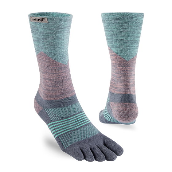Trail Midweight Crew - Women by Injinji in blue and pink with five-toe design to reduce friction, ideal for fast movement on rugged terrain