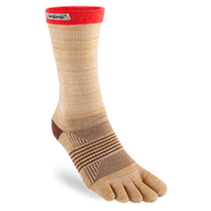 Trail Midweight Crew - Women by Injinji in beige and red toe socks designed to minimize friction and support fast movement on rugged terrain