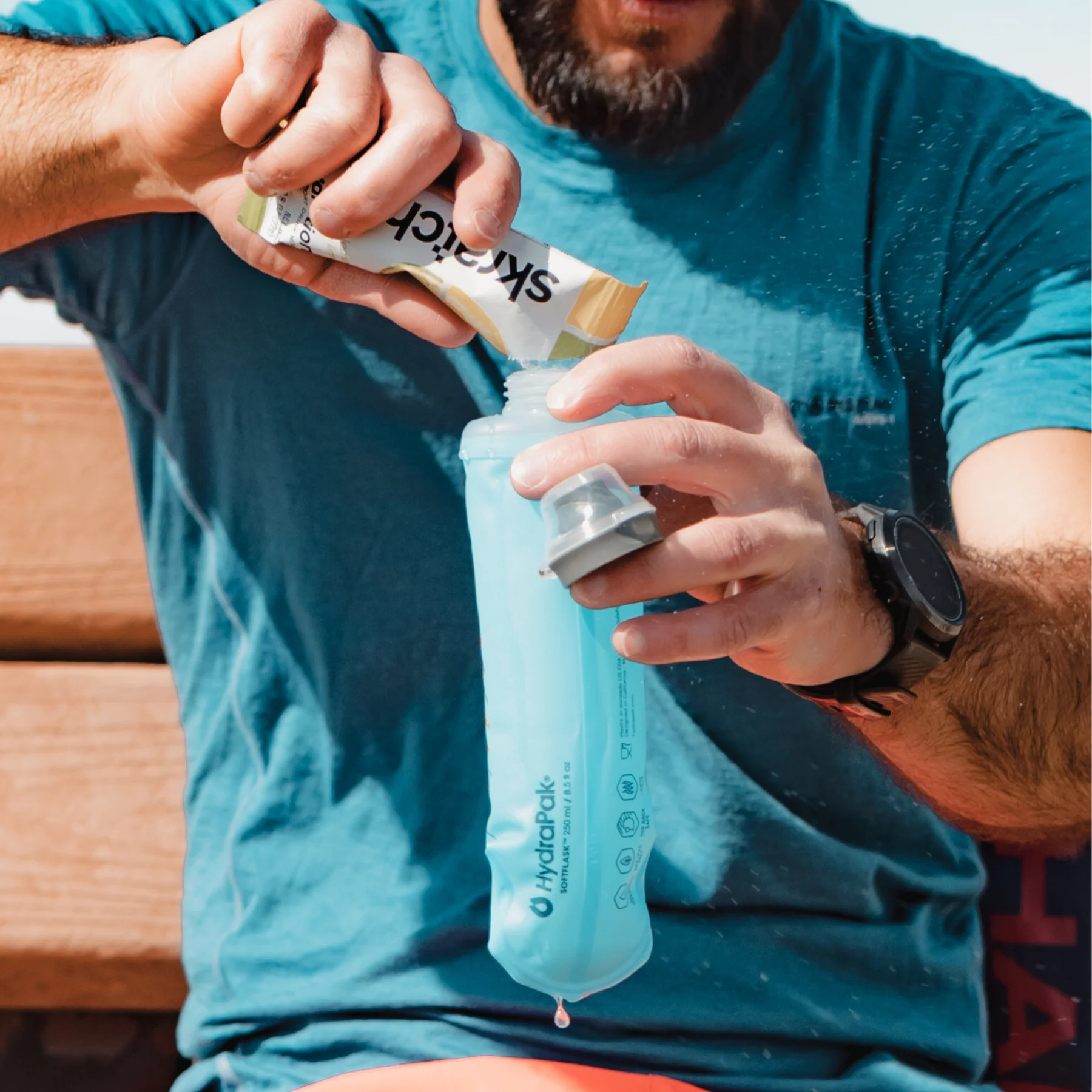 SoftFlask 250ml by Hydrapak in light blue, collapsible hydration flask with soft silicone bite valve ideal for outdoor running and trails