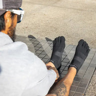 Run Original Weight No-Show by Injinji in black, low-bulk performance running socks with toe protection for blister prevention and all-year use.