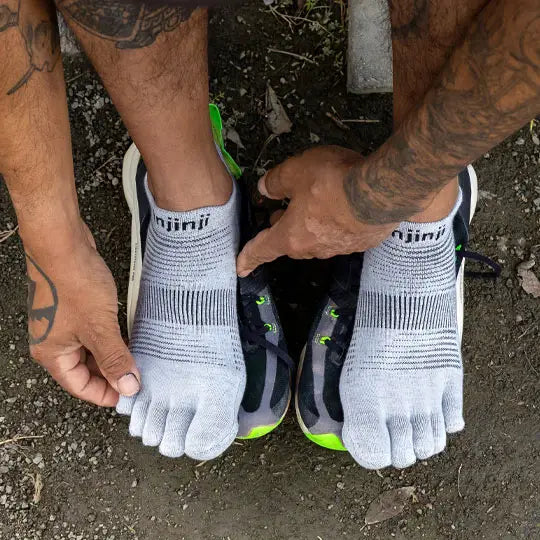 Run Original Weight No-Show by Injinji in grey, low-bulk toe socks designed to prevent blisters for running and racing year-round