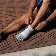 Injinji Run Lightweight No-Show - Unisex white five-toe socks designed for running with minimal bulk and blister prevention