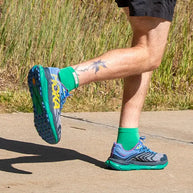 Run Lightweight Mini-Crew - Unisex by Injinji in bright green, designed to prevent blisters and provide comfort for running and outdoor activities