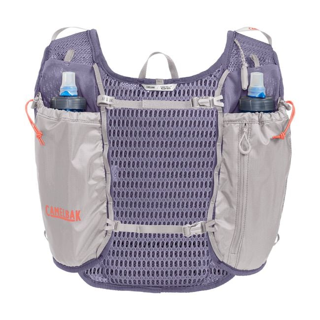 CamelBak Trail Run Vest 5.5L - Women in purple and grey with hydration pockets, ideal for trail running and mountain climbs.