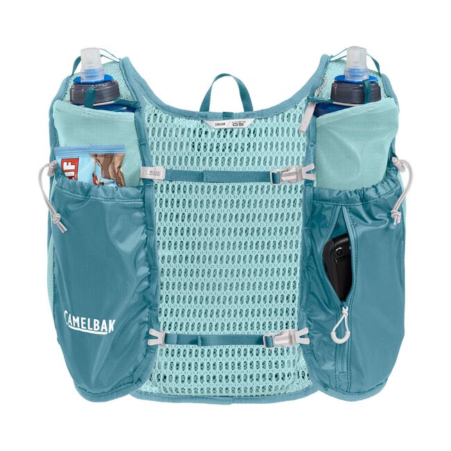 CamelBak Trail Run Vest 5.5L - Women in teal with breathable mesh, multiple pockets, hydration compatible for trail running and mountain miles.