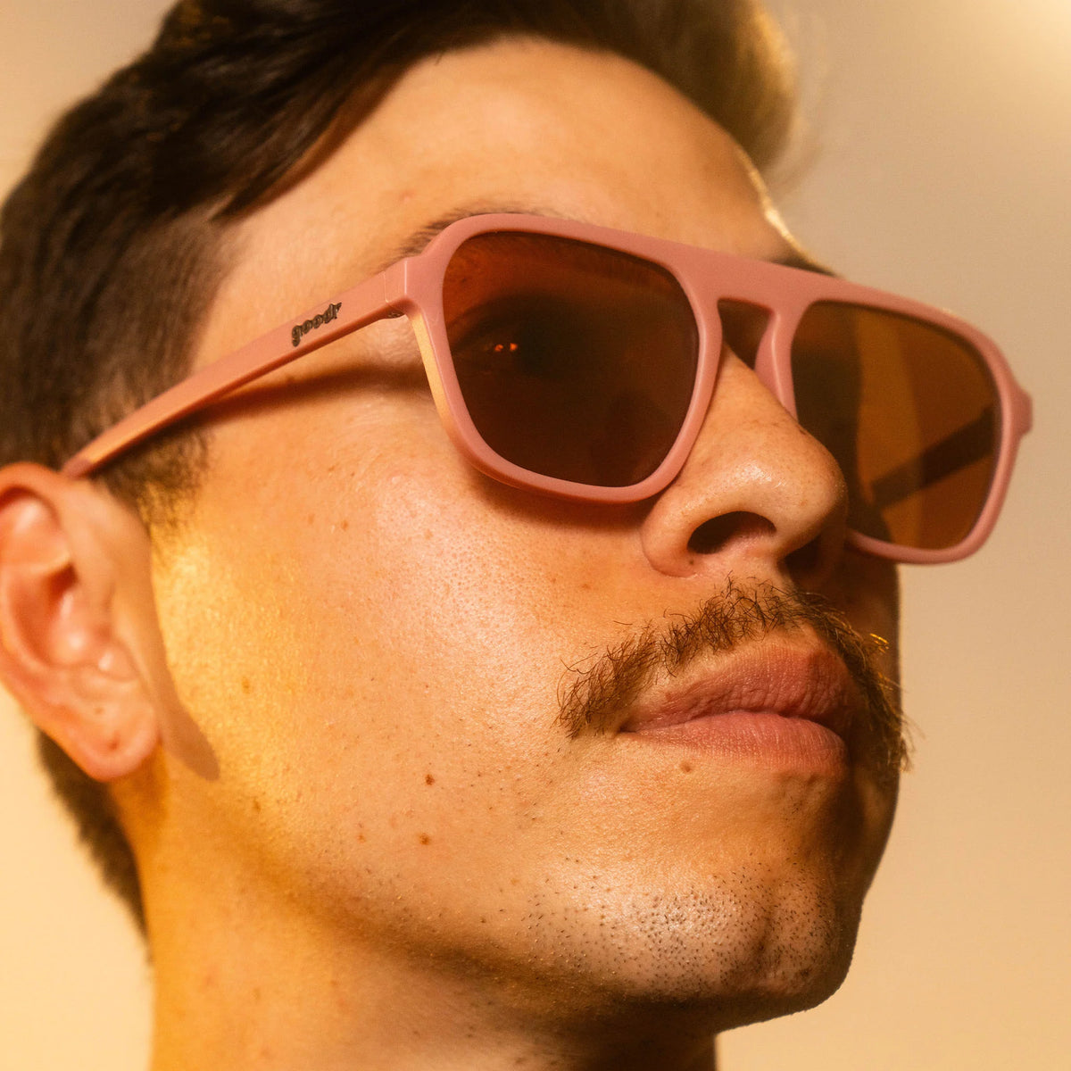 Threaten Me With a Good Time by Goodr in light pink square aviator frames with brown lenses, vintage style for roller rink use