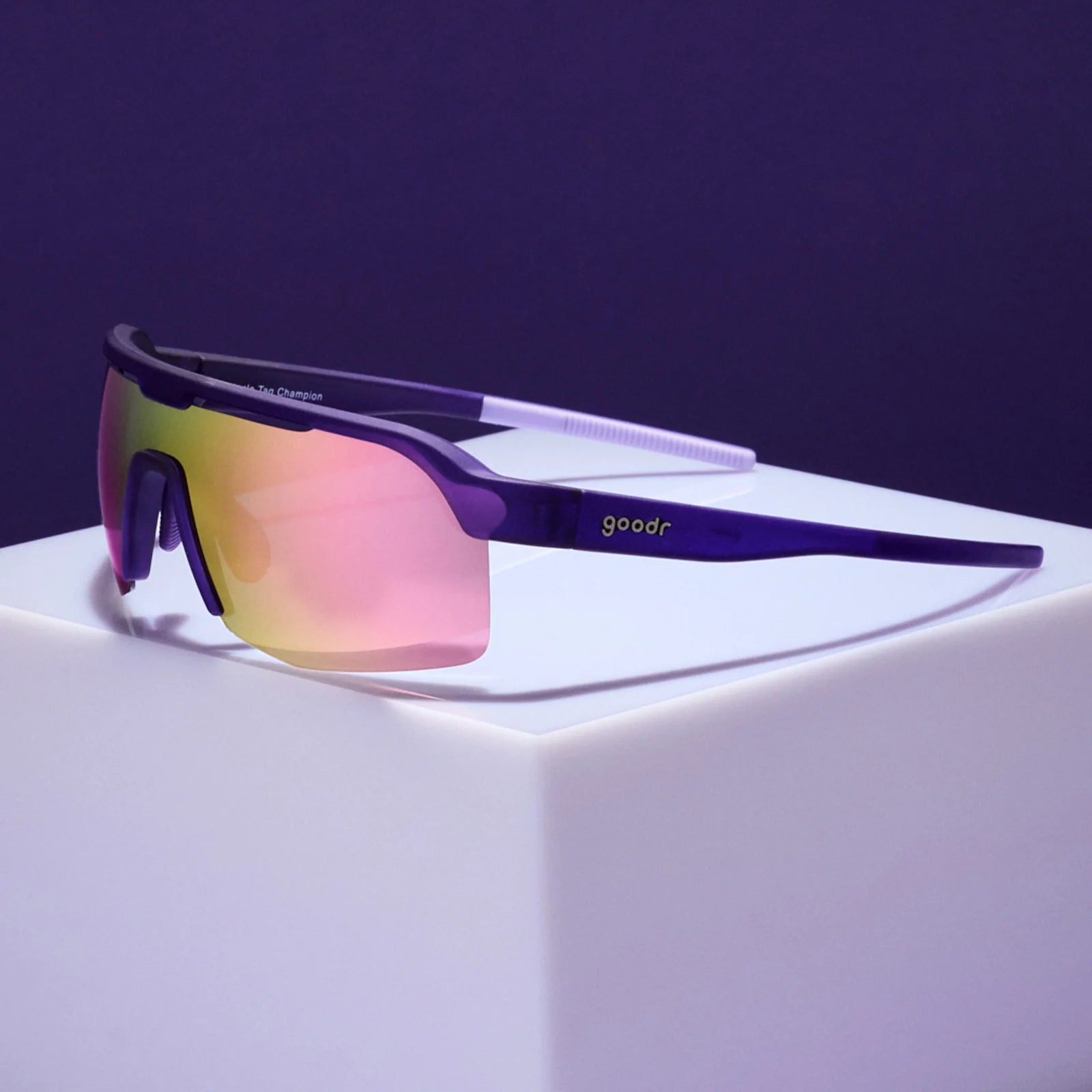 Tentacle Tag Champion by Goodr in purple with half-rim light pink reflective lenses, lightweight sunglasses for running and outdoor use
