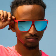 Entourage Sold Separately by Goodr in translucent hot pink with teal reflective lenses, stylish sunglasses ideal for bold outdoor use