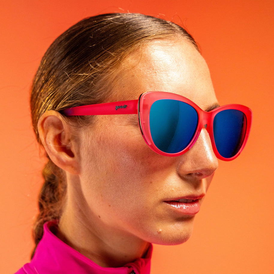 Flamingo Couture by Goodr in translucent pink cat-eye sunglasses with teal reflective lenses and chrome accents for bold outdoor style