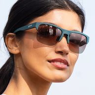 Lawn Mower Drag Race sunglasses by Goodr in solid green with rose gradient lenses and adjustable nose piece for outdoor sporty use