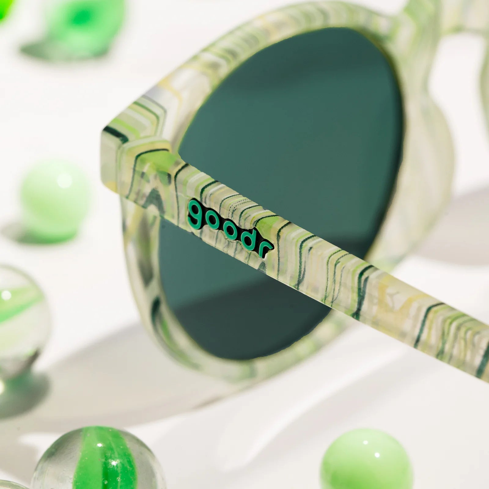 Marble Arts Master by Goodr in glossy green translucent marble frames with green polarized lenses, no-slip for steelie sm outdoors