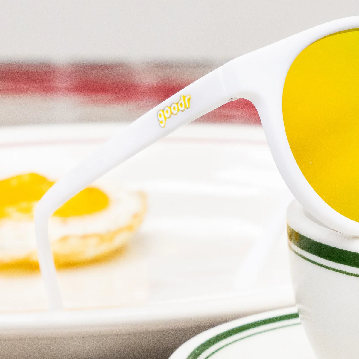 Yolk's On You by Goodr white frame sunglasses with gold polarized lenses, limited-edition sunny-side-up style for outdoor use